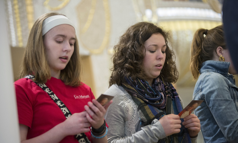 Pilgrims pray together to St. John Paul II 