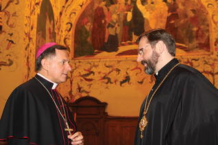 rchbishop Mieczysław Mokrzycki of Lviv talks with Major Archbishop Sviatoslav Shevchuk.