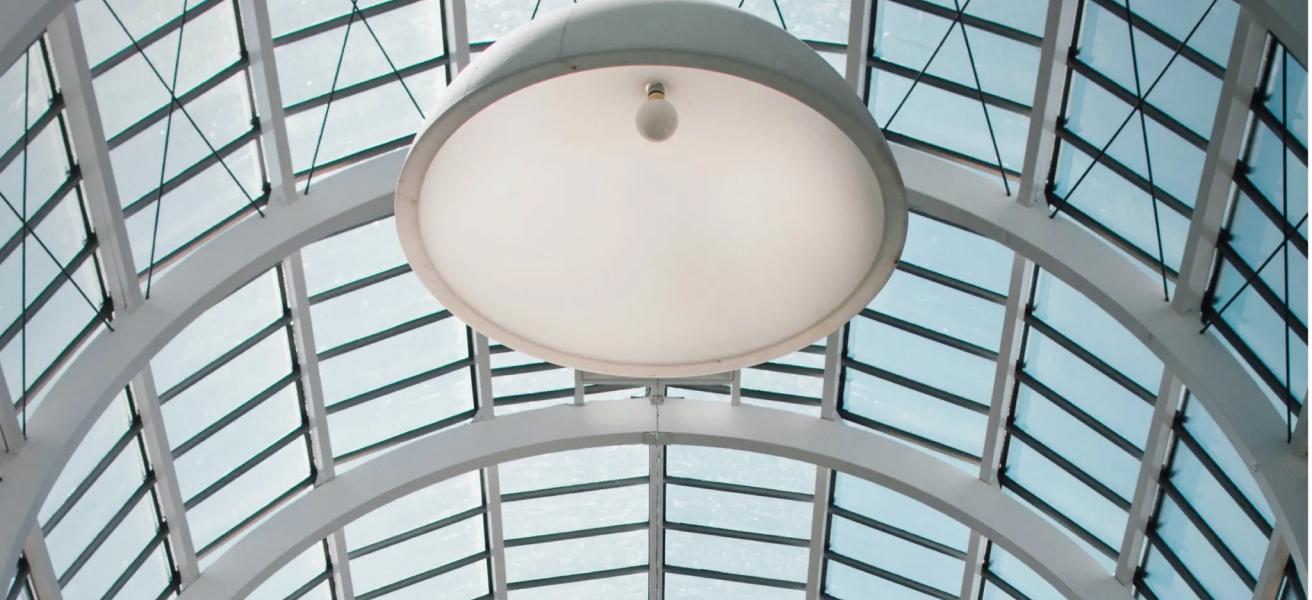 Glass ceiling with large light in the center.