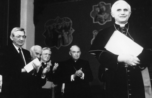 Supreme Knight Virgil Dechant (left) and other guests applaud Cardinal Joseph Ratzinger during his 1990 visit to Washington, D.C., to address the Pontifical John Paul II Institute for Studies on Marriage and Family.