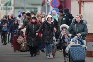 Refugees from Ukraine enter Poland on foot