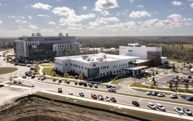 Leaders gather to celebrate the grand opening of the Moffitt Speros Outpatient Center.