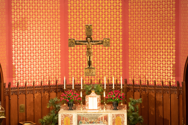 Photo of St. Mary's Church interior with  Carolingian-style crucifix designed by Tommaso Gismondi suspended over altar.