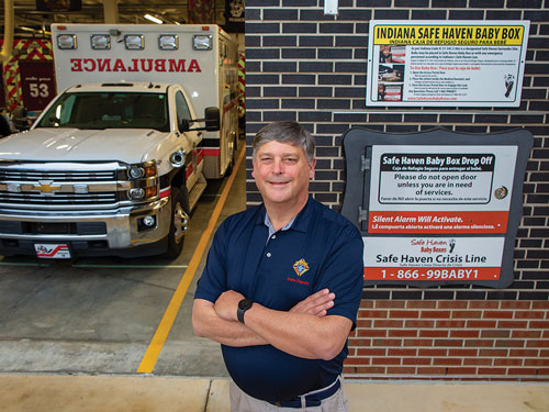 Indiana State Deputy Scott Schutte stands next to the Safe Haven Baby Box that he and his council helped install at Fire Station 53 in Greenwood, Ind., in 2020. (Photo by Zach Dobson)