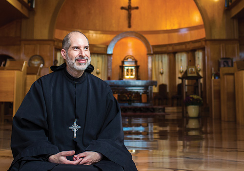 Father Patrick Kokorian is pictured in the chapel of Most Holy Trinity Monastery in Petersham, Mass., where he serves as abbot of the Maronite Monks of Adoration community. The Truth Is Out There (right) is the first volume of Abbot Kokorian&rsquo;s three-part Brendan & Erc in Exile comic book series published by Catholic Answers.