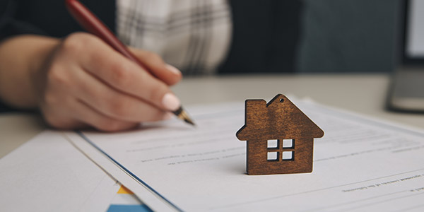 A person signing paperwork 