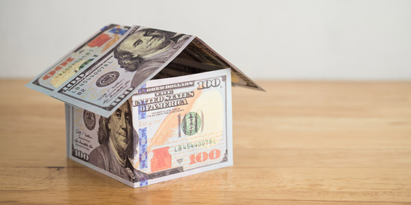 model house made of hundred dollar bills