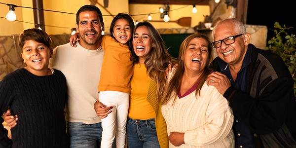 A multi-generational Hispanic family celebrating together 