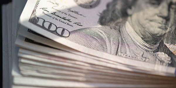 stack of hundred dollar bills 