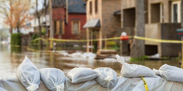 A wall made of sandbags in a flooded area