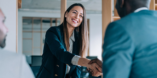 agent shaking hands with client