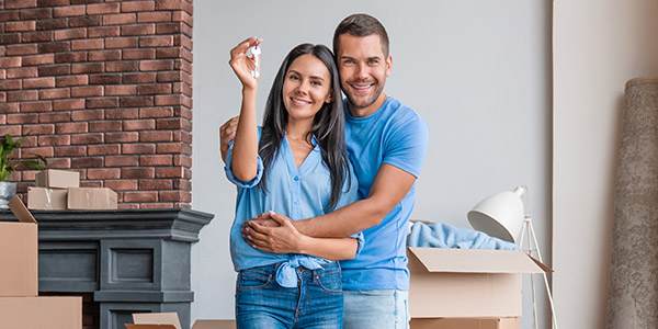 couple showing of their new house keys