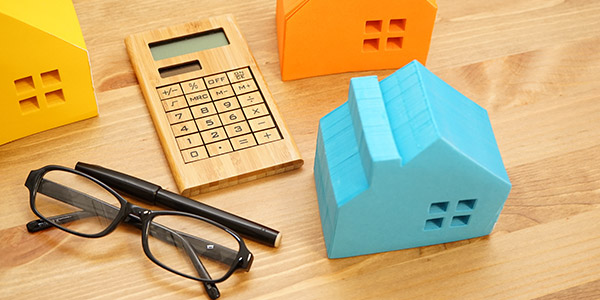 house models, calculator and eyeglasses