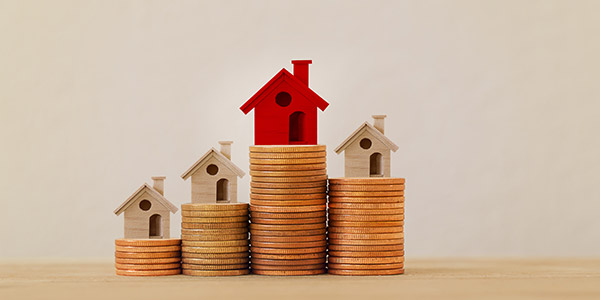 home model on stacks of coins