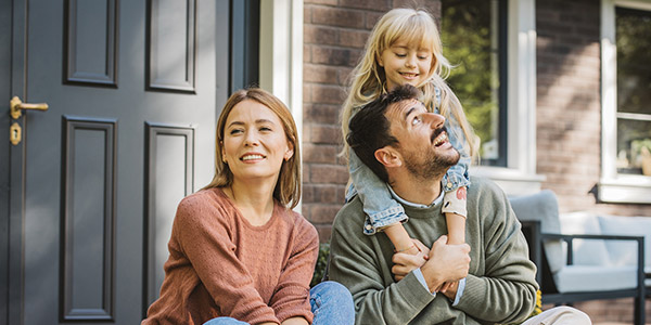 family sitting on their porch