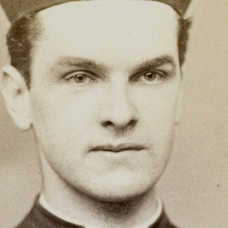 Black and white photo closeup of Father McGivney's face as a young priest.