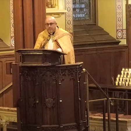 Father Jeffrey Romans speaks from the pulpit of St. Mary's Church, New Haven, CT, during Solemn Vespers on August 12, 2022. 