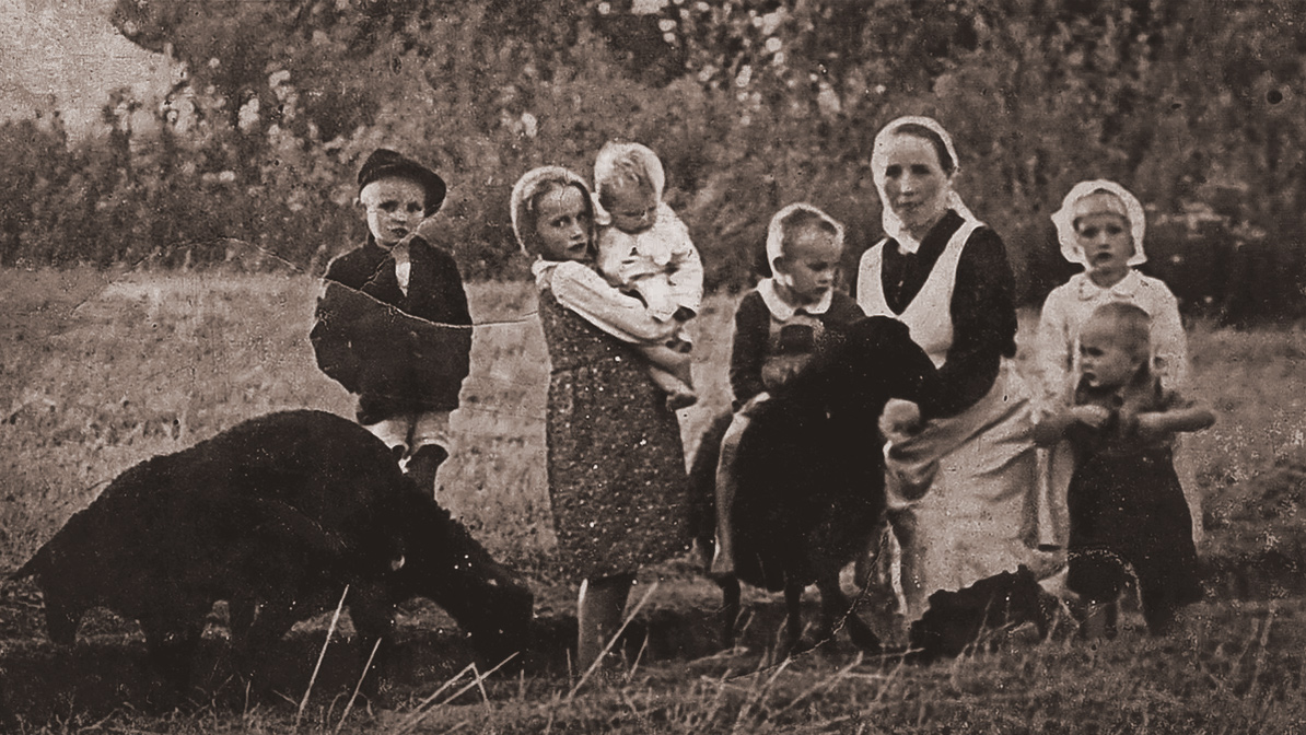 A black and white photograph of Wiktoria Ulma and her children