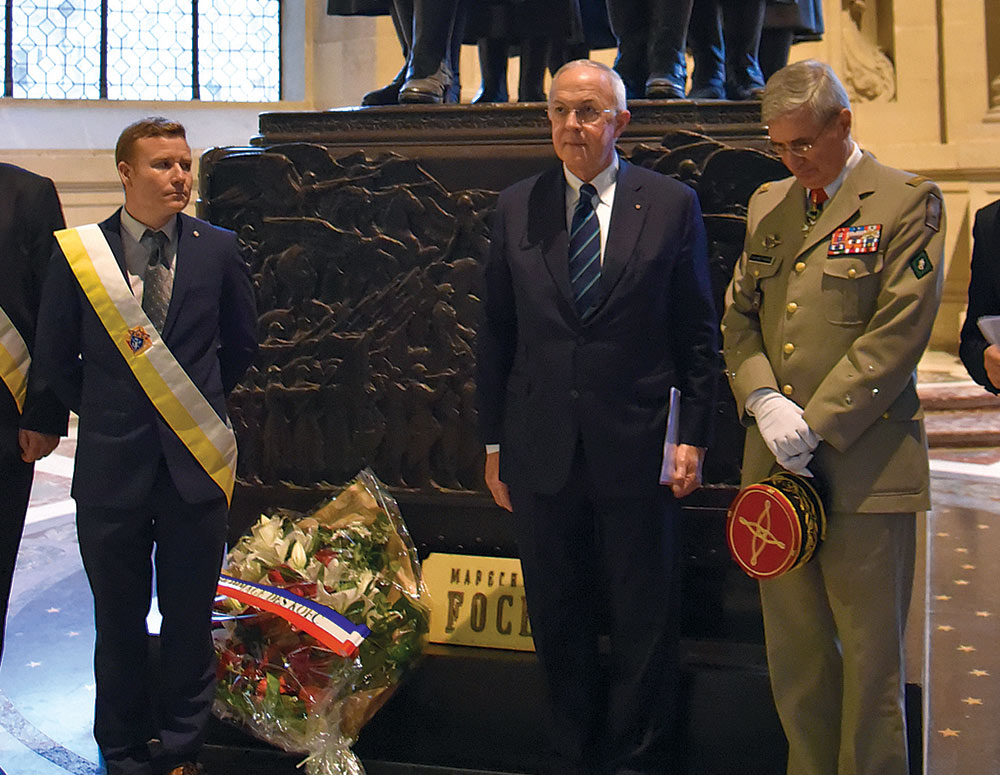 Supreme Knight Anderson is pictured after laying a wreath at the tomb of Marshal Ferdinand Foch, supreme allied commander during World War I and the first Knight of Columbus in France. The supreme knight was accompanied by Lt. Gen. Christophe de Saint-Chamas, military governor of the H&ocirc;tel des Invalides (right), and a delegation of French Knights.