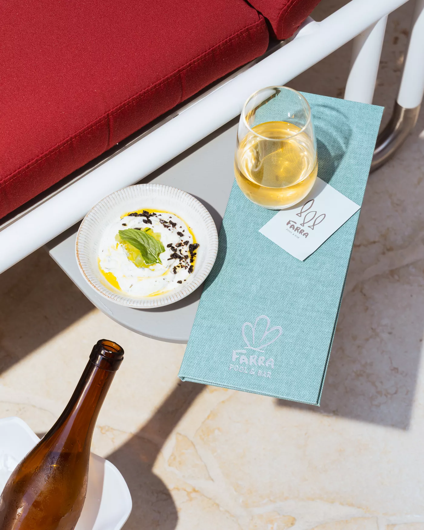bowl of dip, wine and menu
